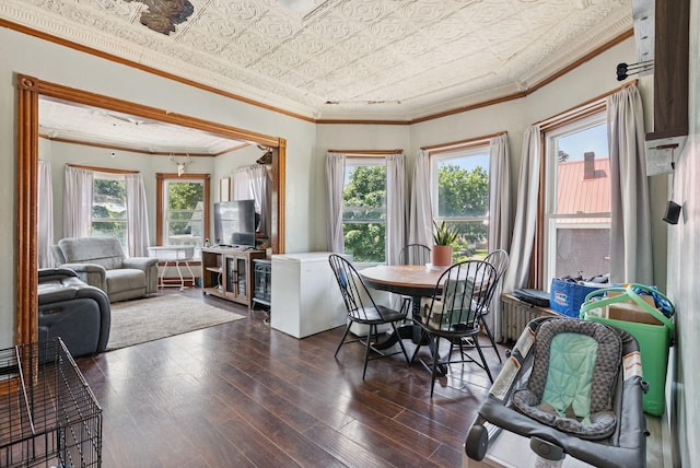 93 Chapel St, South Portland, ME 04106 - dining space with an ornate ceiling, dark wood-type flooring, and crown molding