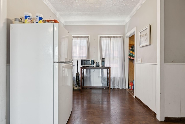 93 Chapel St, South Portland, ME 04106 - kitchen featuring freestanding refrigerator, crown molding, hardwood / wood-style flooring, stainless steel microwave, and an ornate ceiling