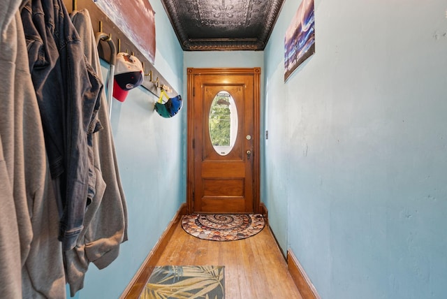 93 Chapel St, South Portland, ME 04106 - doorway with light wood-style floors and an ornate ceiling