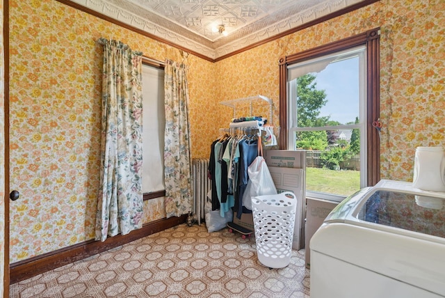 93 Chapel St, South Portland, ME 04106 - laundry room with plenty of natural light, wallpapered walls, ornamental molding, an ornate ceiling, and radiator heating unit