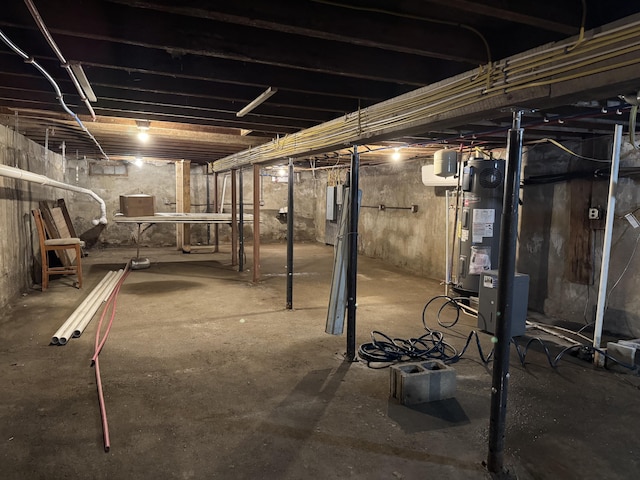 40 Elm St, Waterville, ME 04901 - unfinished basement featuring water heater