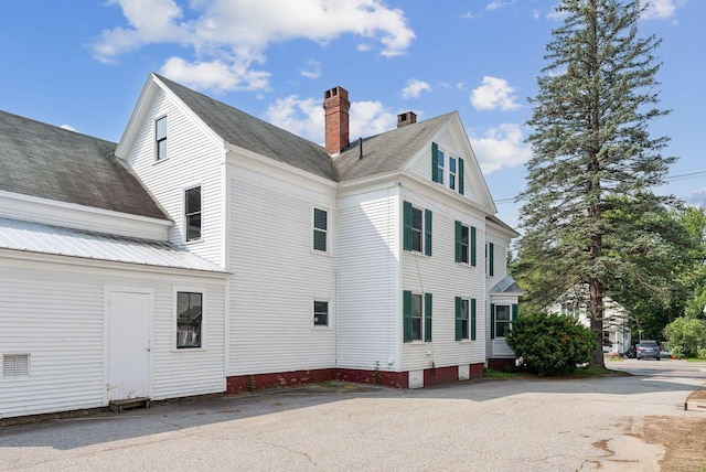 201 Main St, Norway, ME 04268 - view of home's exterior featuring a chimney