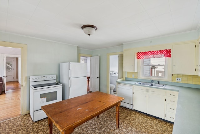 201 Main St, Norway, ME 04268 - kitchen featuring white appliances, light countertops, ornamental molding, light flooring, and washer / clothes dryer