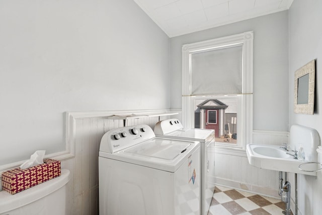 201 Main St, Norway, ME 04268 - washroom with separate washer and dryer, tile patterned floors, and wainscoting