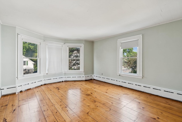 201 Main St, Norway, ME 04268 - unfurnished room featuring plenty of natural light, crown molding, light wood finished floors, and baseboard heating