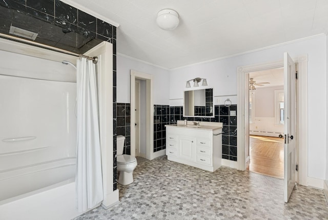 201 Main St, Norway, ME 04268 - full bathroom with tile walls, ornamental molding, vanity, a baseboard radiator, and shower / bathtub combination with curtain