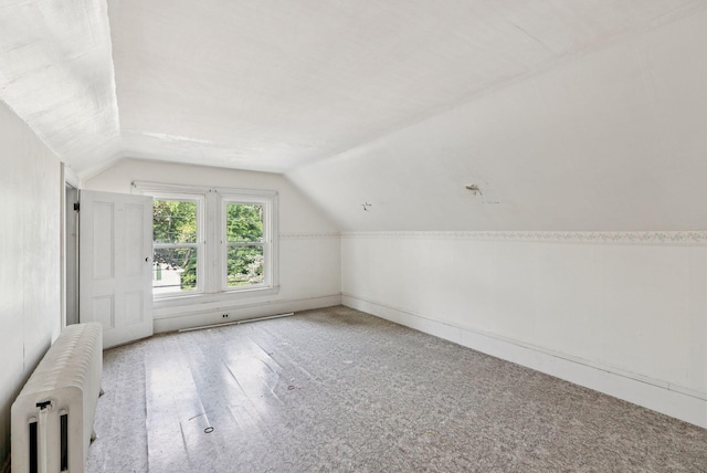 201 Main St, Norway, ME 04268 - additional living space featuring radiator and lofted ceiling