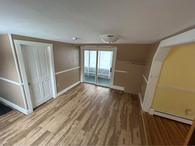 323 Pine St, Dover-Foxcroft, ME 04426 - unfurnished living room with a baseboard radiator and wood finished floors