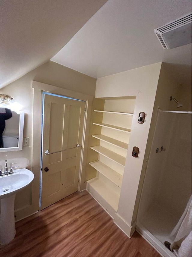 323 Pine St, Dover-Foxcroft, ME 04426 - bathroom with wood finished floors and a shower