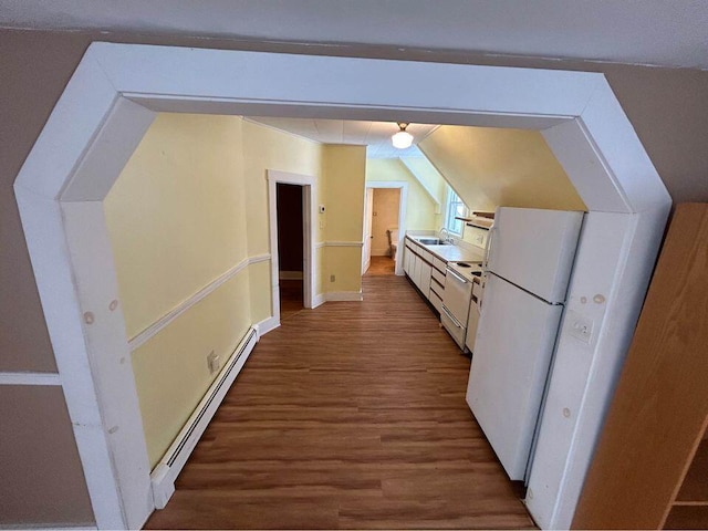 323 Pine St, Dover-Foxcroft, ME 04426 - bonus room featuring a baseboard radiator, wood finished floors, and lofted ceiling