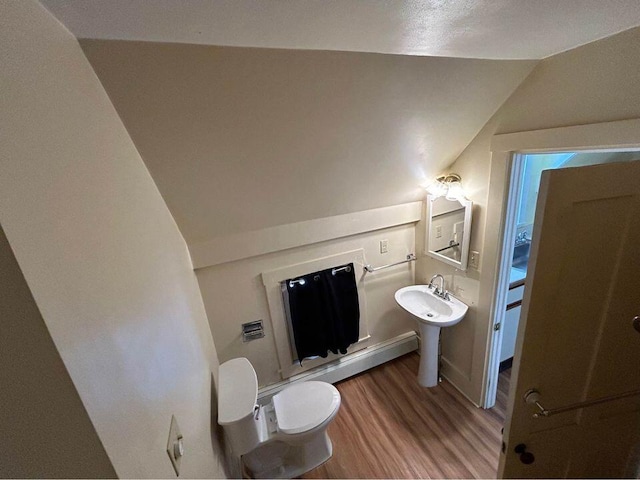 323 Pine St, Dover-Foxcroft, ME 04426 - bathroom featuring vaulted ceiling and wood finished floors