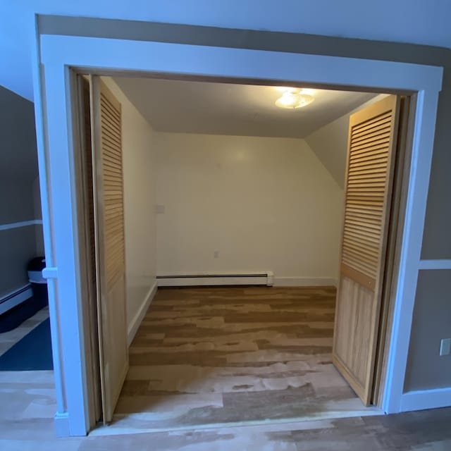 323 Pine St, Dover-Foxcroft, ME 04426 - corridor featuring a baseboard heating unit and lofted ceiling