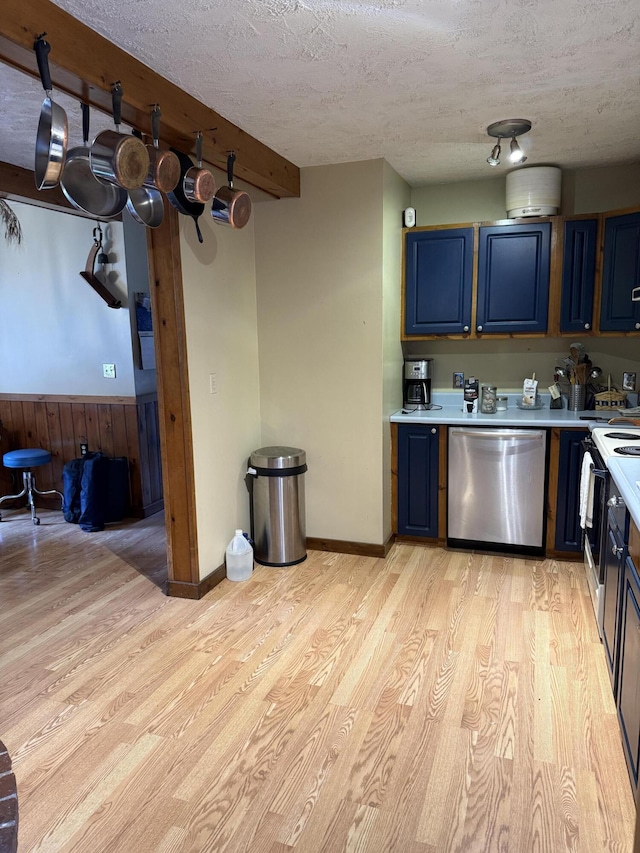 333 Mohawk Rd, Enfield, ME 04493 - kitchen with stainless steel dishwasher, blue cabinets, light wood-style flooring, and a textured ceiling