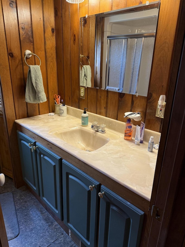 333 Mohawk Rd, Enfield, ME 04493 - full bathroom featuring vanity, wood walls, and a shower stall