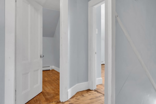 120 Holland St, Lewiston, ME 04240 - corridor featuring a baseboard heating unit and wood finished floors