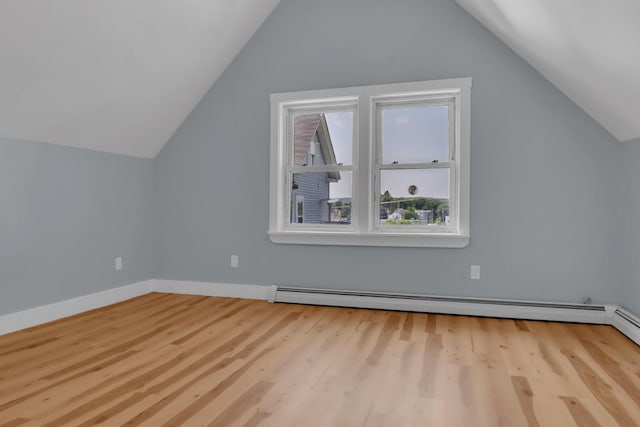 120 Holland St, Lewiston, ME 04240 - additional living space with lofted ceiling, wood finished floors, and baseboard heating