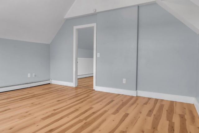 120 Holland St, Lewiston, ME 04240 - additional living space with lofted ceiling, wood finished floors, and baseboard heating