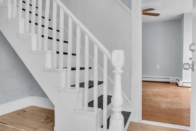120 Holland St, Lewiston, ME 04240 - staircase featuring ceiling fan, a baseboard radiator, and wood finished floors