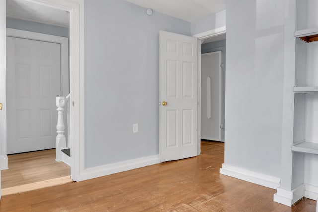 120 Holland St, Lewiston, ME 04240 - unfurnished bedroom featuring light wood-style flooring and baseboards