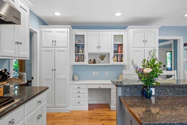6 Ocean View Dr, Biddeford, ME 04005 - kitchen with wall chimney exhaust hood, built in desk, white cabinetry, light wood-type flooring, and open shelves