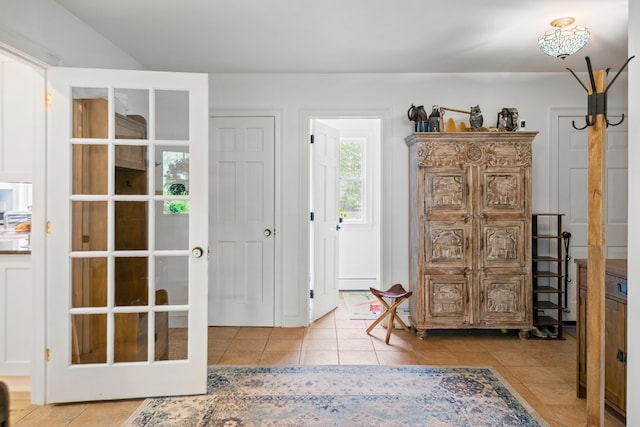 6 Ocean View Dr, Biddeford, ME 04005 - foyer with tile patterned floors, a baseboard radiator, and french doors