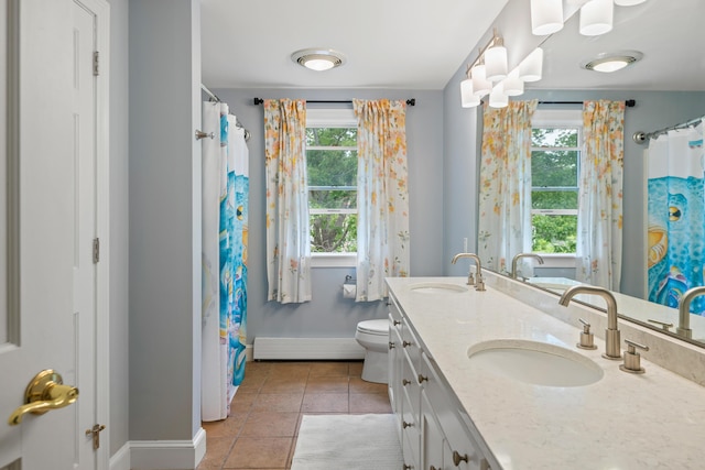 6 Ocean View Dr, Biddeford, ME 04005 - bathroom with a baseboard radiator, double vanity, tile patterned flooring, and a shower with shower curtain