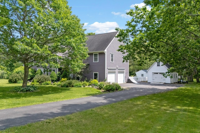 6 Ocean View Dr, Biddeford, ME 04005 - view of front facade with a front lawn, a garage, and an outbuilding