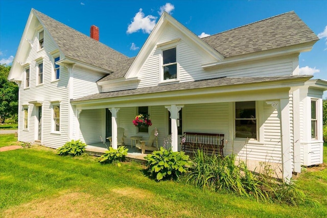 3 Salt Pond Rd, Friendship, ME 04547 - rear view of house featuring a chimney, covered porch, a yard, and roof with shingles