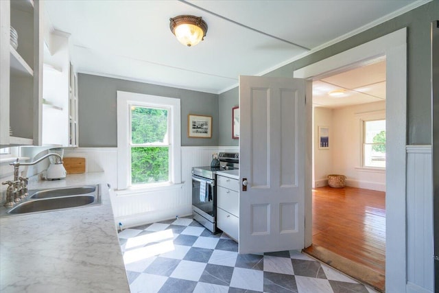 3 Salt Pond Rd, Friendship, ME 04547 - kitchen featuring stainless steel electric range oven, plenty of natural light, a wainscoted wall, ornamental molding, and light countertops
