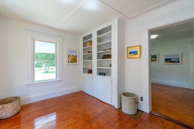 3 Salt Pond Rd, Friendship, ME 04547 - unfurnished dining area with wood finished floors, crown molding, and built in shelves