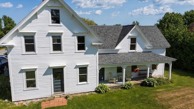 3 Salt Pond Rd, Friendship, ME 04547 - rear view of property with a shingled roof, a yard, and covered porch