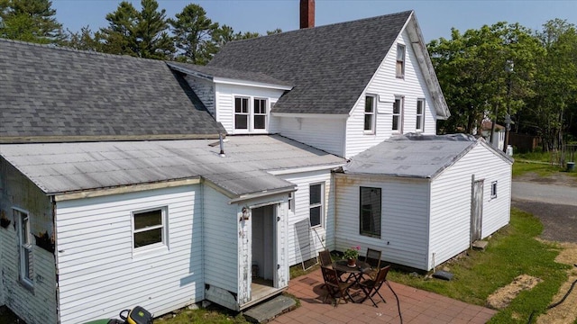 3 Salt Pond Rd, Friendship, ME 04547 - rear view of property with a chimney, a shingled roof, and a patio area