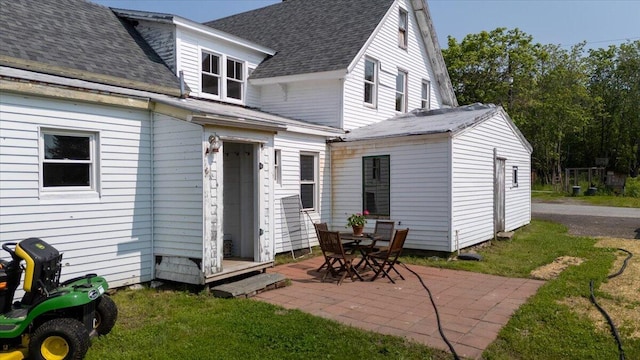 3 Salt Pond Rd, Friendship, ME 04547 - back of property featuring a patio, a yard, and roof with shingles