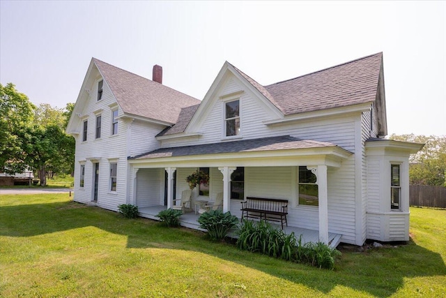 3 Salt Pond Rd, Friendship, ME 04547 - view of front facade featuring a shingled roof, a front yard, a porch, and a chimney