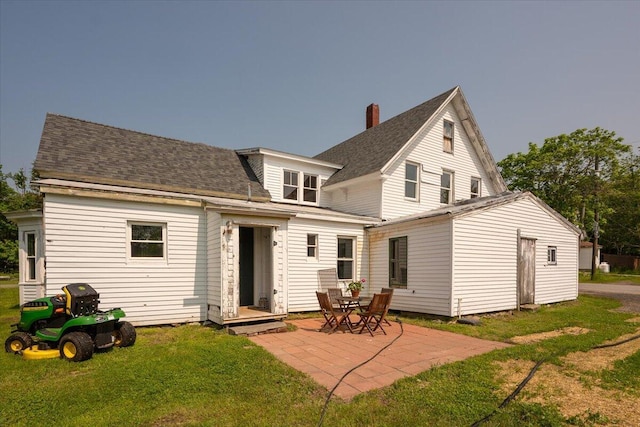 3 Salt Pond Rd, Friendship, ME 04547 - back of property featuring a lawn, a patio, and roof with shingles