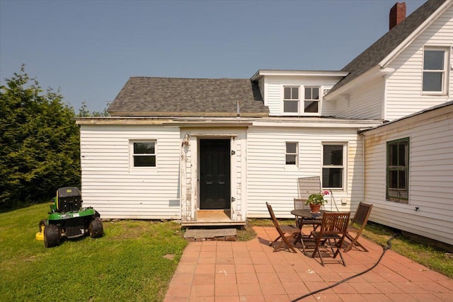 3 Salt Pond Rd, Friendship, ME 04547 - rear view of property featuring a patio area, a lawn, and roof with shingles