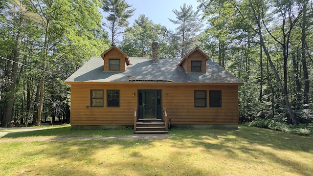 105 Highland Pines Rd, Bridgton, ME 04009 - view of front facade featuring a front lawn and a chimney