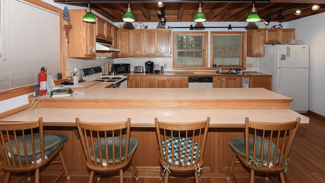 105 Highland Pines Rd, Bridgton, ME 04009 - kitchen featuring white appliances, under cabinet range hood, a peninsula, track lighting, and a wood ceiling with exposed beams