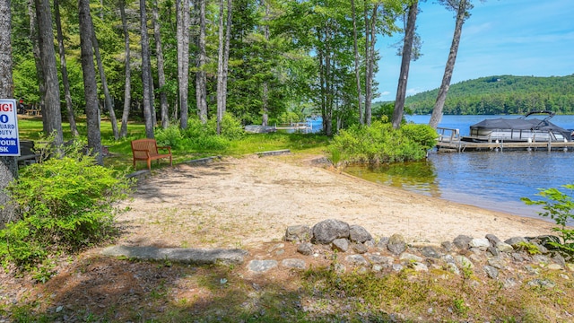 105 Highland Pines Rd, Bridgton, ME 04009 - view of yard with a dock and a water view