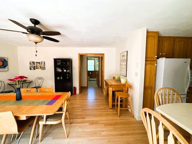 429 Moosehead Trail Highway, Waldo, ME 04915 - dining space with light wood finished floors and a ceiling fan