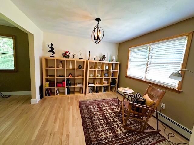 429 Moosehead Trail Highway, Waldo, ME 04915 - sitting room with plenty of natural light and wood finished floors