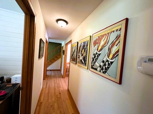 429 Moosehead Trail Highway, Waldo, ME 04915 - hallway with light wood finished floors and stairway
