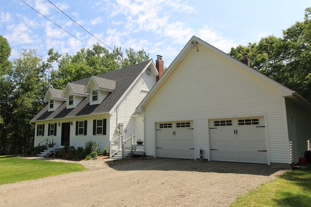 429 Moosehead Trail Highway, Waldo, ME 04915 - new england style home featuring dirt driveway, a shingled roof, a chimney, and a garage
