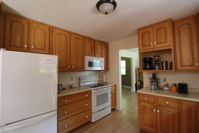 429 Moosehead Trail Highway, Waldo, ME 04915 - kitchen with white appliances, light countertops, brown cabinets, light wood finished floors, and open shelves