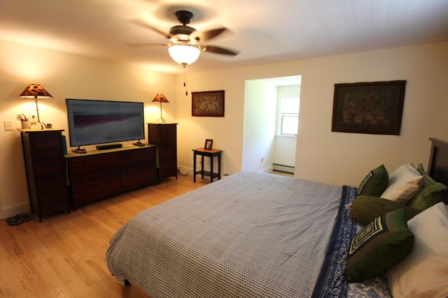 429 Moosehead Trail Highway, Waldo, ME 04915 - bedroom with light wood-type flooring, a ceiling fan, and a baseboard heating unit