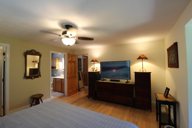 429 Moosehead Trail Highway, Waldo, ME 04915 - bedroom featuring light wood-style floors, ceiling fan, and connected bathroom