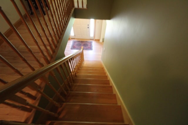 429 Moosehead Trail Highway, Waldo, ME 04915 - stairway featuring baseboards and wood finished floors