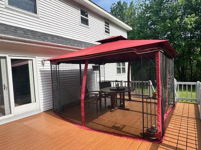429 Moosehead Trail Highway, Waldo, ME 04915 - deck with a gazebo and outdoor dining space