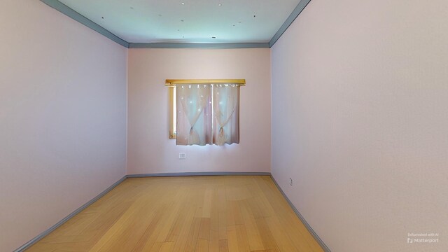 37 Mill St, Enfield, ME 04493 - unfurnished room featuring wood finished floors and crown molding