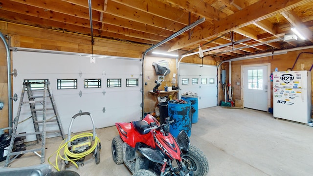 37 Mill St, Enfield, ME 04493 - garage featuring freestanding refrigerator